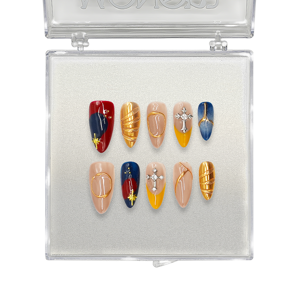 Luxury press-on nails in a bold red, blue, and gold design with cross charms, metallic accents, and geometric patterns. Perfect for elegant and artistic nail styling